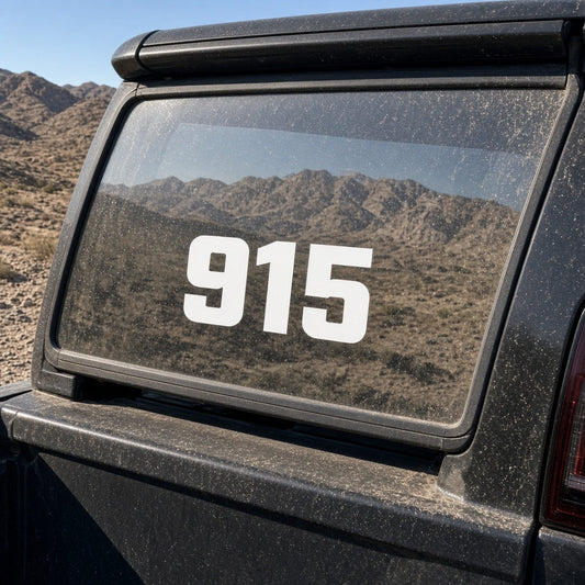 915 El Paso vinyl decal on the rear window of a black pickup truck