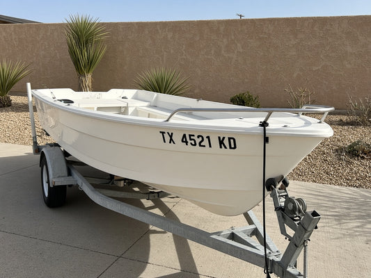 Boat registration number decal TX 4521 KD on a white boat bow