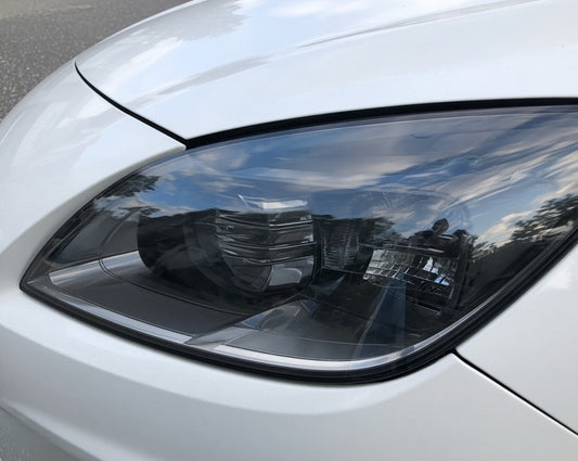Smoked tint film on a car headlight